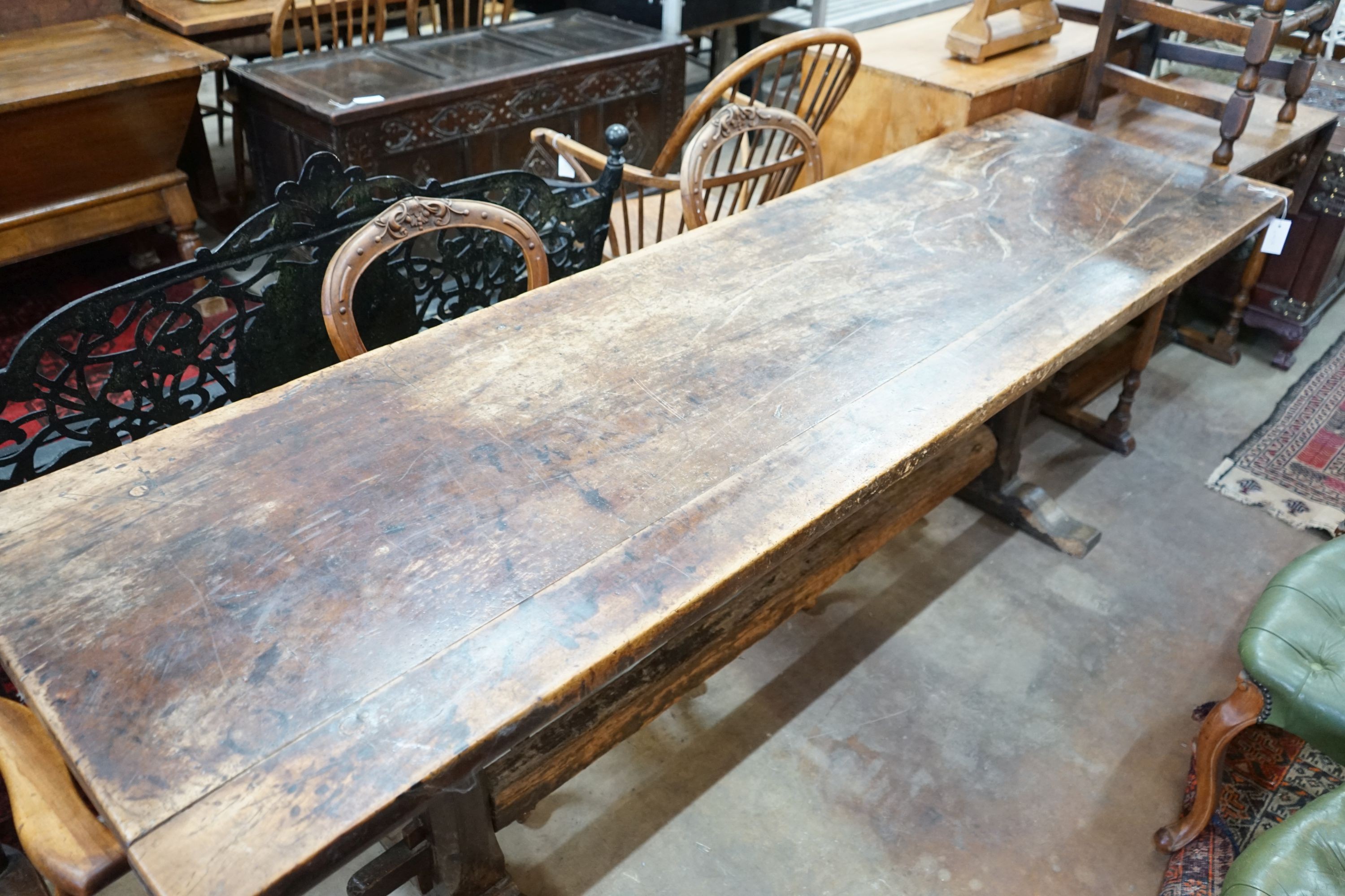 A rectangular oak refectory dining table, length 228cm, depth 64cm, height 78cm